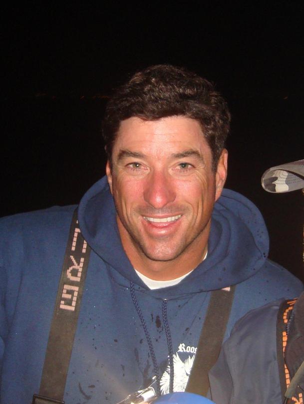 Person outdoors wearing a blue sweatshirt